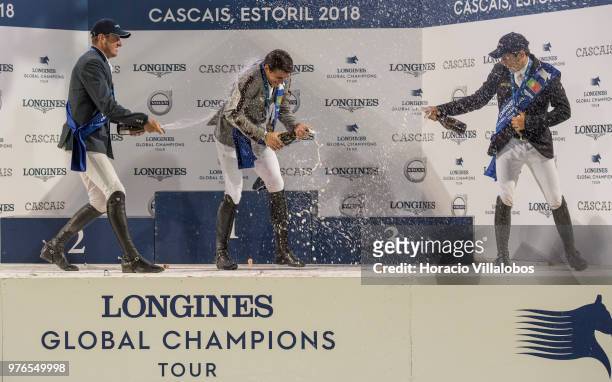 Winner Nicola Philippaerts jubilates with champagne with Gregory Wathelet and Eduardo Alvarez Aznar at the end of the awards ceremony of "CSI 5"...
