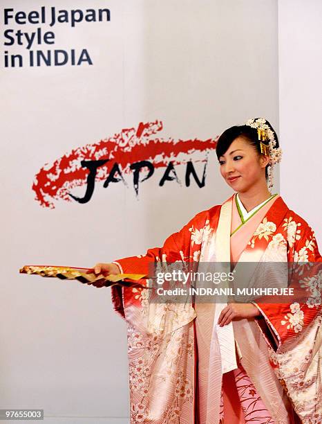 Performing artist from the Takarazuka Theatre School Yuri Shirahane performs a traditional Japanese dance commemorating the �Sakura� - the national...