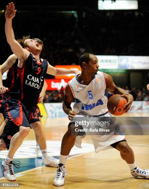 Marcelinho Huertas, #9 of Caja Laboral competes with Jamont Gordon, #5 of KK Cibona Zagreb during the Euroleague Basketball 2009-2010 Last 16 Game 6...