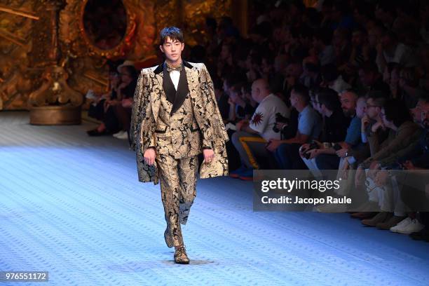 Nam Joo-hyuk walks the runway at the Dolce & Gabbana show during Milan Men's Fashion Week Spring/Summer 2019 on June 16, 2018 in Milan, Italy.