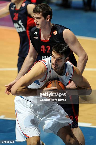 Dalibor Bagaric, #14 of KK Cibona Zagreb competes with Stanko Barac, #42 of Caja Laboral during the Euroleague Basketball 2009-2010 Last 16 Game 6...