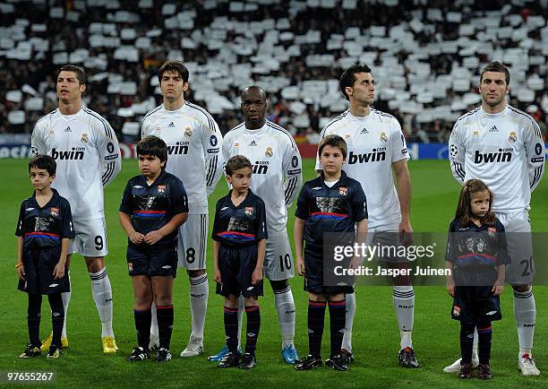 Cristiano Ronaldo, Kaka, Lassana Diarra, Alvaro Arbeloa and Gonzalo Higuain stand ready at the start of the UEFA Champions League round of 16 second...