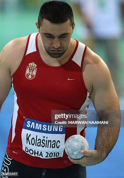 Serbia's Asmir Kolasinac competes in the men's shot put group B qualifying round at the 2010 IAAF World Indoor Athletics Championships at the Aspire...