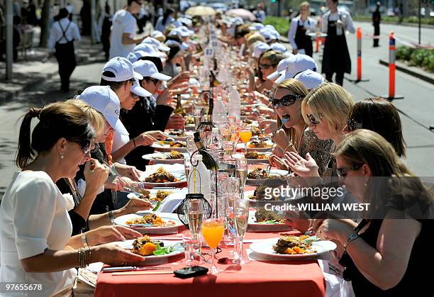 People enjoy their meals at an event named "World's Longest Lunch" at this year's Melbourne Food and Wine Festival in Melbourne on March 12, 2010. A...