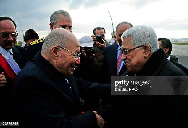 In this handout image supplied by the Palestinian Press Office , Palestinian President Mahmoud Abbas is greeted by Advisor to the President of...