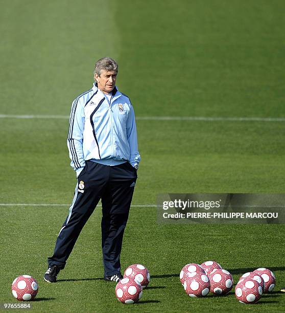 Real Madrid's head coach Chilean Manuel Pellegrini looks on during a training session in Madrid, on March 11, 2010 the day after being defeated by...