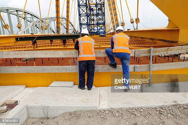two construction workers - bridge built structure stock pictures, royalty-free photos & images