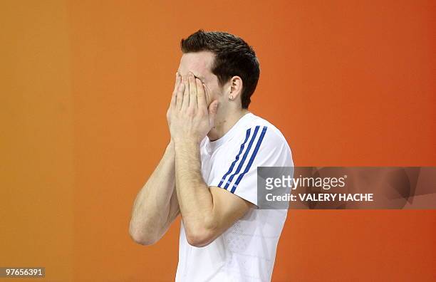 France's Renaud Lavillenie reacts after failing to qualify for the next round in the men's pole vault at the 2010 IAAF World Indoor Athletics...