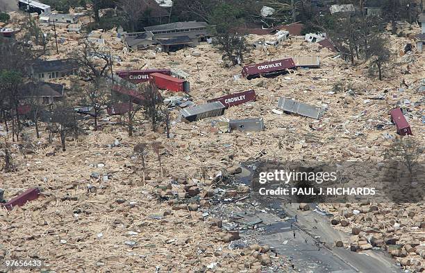 Residental area is engulfed in shipping containers, RVs, and boats washed ashore 30 August 2005 in Gulfport, Mississippi following high winds and...