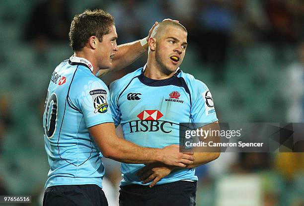 Drew Mitchell of the Waratahs is congratulated by team mate Josh Holmes after scoring a try during the round five Super 14 match between the Waratahs...