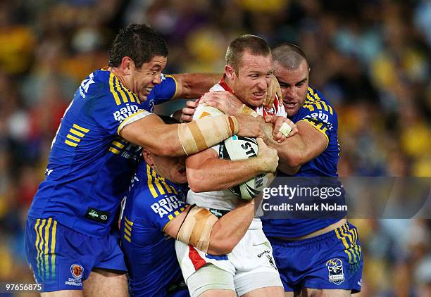 Ben Hornby of the Dragons is atckled during the round one NRL match between the Parramatta Eels and the St George Illawarra Dragons at Parramatta...