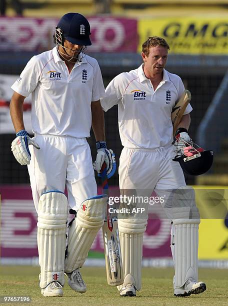 England cricket team captain Alastair Cook and teammate Paul Collingwood leave the field after the end of play on the first day of the first Test...