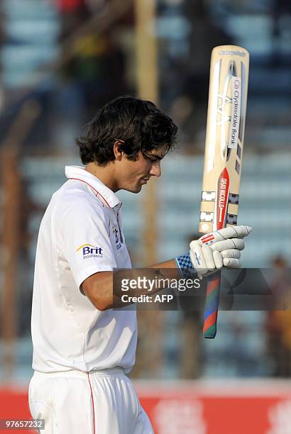 England cricket team captain Alastair Cook acknowledges the crowd as he leaves the field after the end of play on the first day of the first Test...