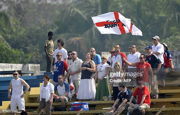 England cricket supporters cheer for their team during play on the first day of the first Test match between Bangladesh and England at The Zohur...