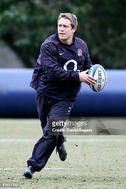 Jonny Wilkinson runs with the ball during the England rugby union squad training session at Pennyhill Park on March 12, 2010 in Bagshot, England.
