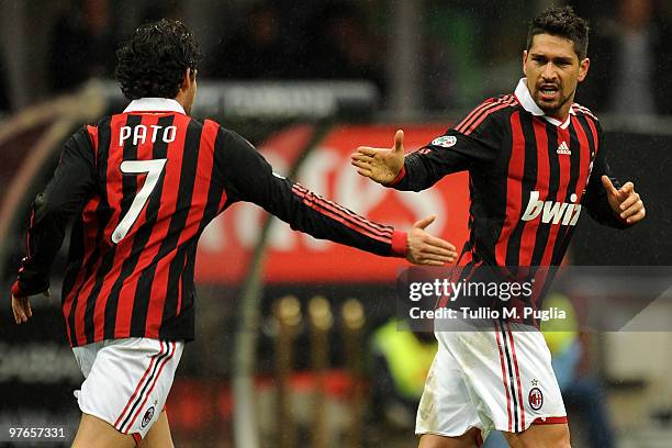 Marco Borriello of Milan celebrates with team mate Pato after his goal during the Serie A match between Milan and Atalanta at Stadio Giuseppe Meazza...