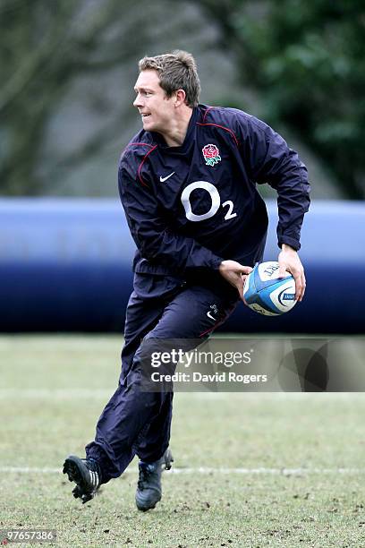 Jonny Wilkinson passes the ball during the England rugby union squad training session at Pennyhill Park on March 12, 2010 in Bagshot, England.