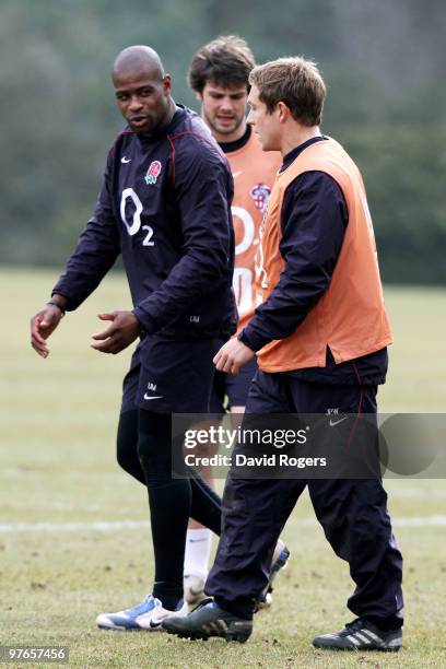 Jonny Wilkinson speaks with teammate Ugo Monye during the England rugby union squad training session at Pennyhill Park on March 12, 2010 in Bagshot,...