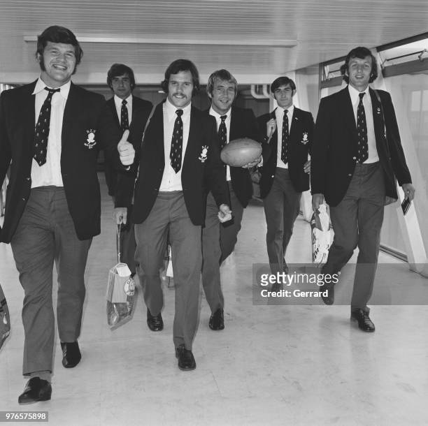 England rugby players arriving at Heathrow Airport from New Zealand, London, UK, 18th September 1973; they are: Fran Cotton, Geoff Evans, David...
