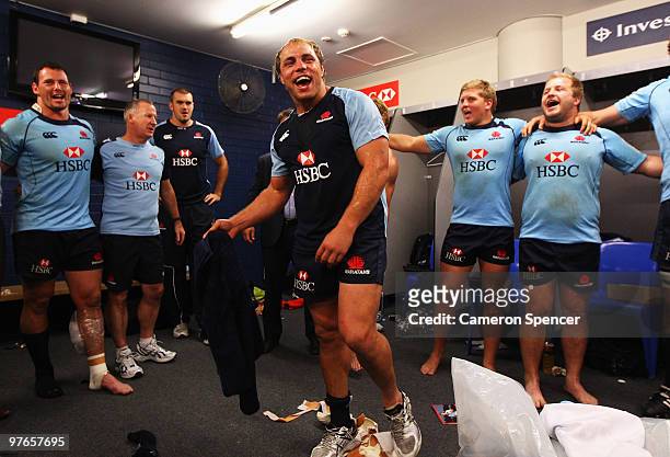 Waratahs captain Phil Waugh leads the team song in their changeroom after winning the round five Super 14 match between the Waratahs and the Lions...