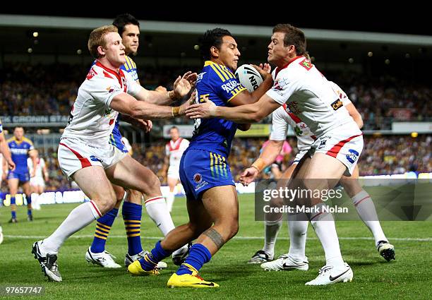 Krisnan Inu of the Eels is tackled during the round one NRL match between the Parramatta Eels and the St George Illawarra Dragons at Parramatta...