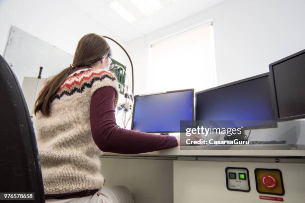 female research scientist working on computer - computer scientist stock pictures, royalty-free photos & images