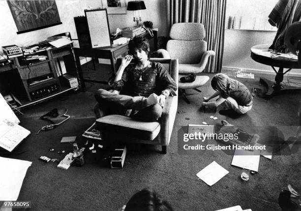 Keith Richards from The Rolling Stones posed in Brussels, Belgium with his son Marlon Richards playing beside him on May 06 1976.