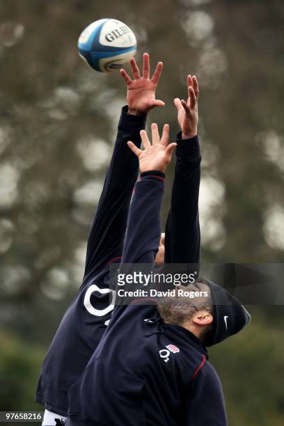 Nick Easter jumps for lineout ball against Courtney Lawes during the England rugby union squad training session at Pennyhill Park on March 12, 2010...