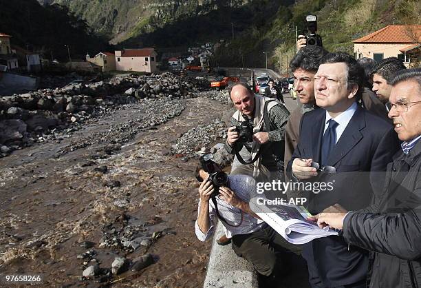 European Comission's president Portuguese Jose Durao Barroso looks to an afected area during his one-day visit to Madeira Island on March 12, 2010....