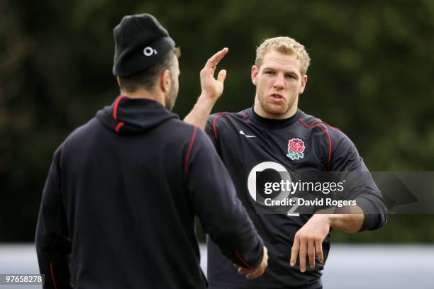 Back row colleagues James Haskell and Nick Easter discuss tactics during the England rugby union squad training session at Pennyhill Park on March...