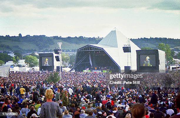 Festival crowd watch Ocean Colour Scene perform on the Pyramid Stage at the Glastonbury Festival on June 24th, 2000 in Glastonbury, England.