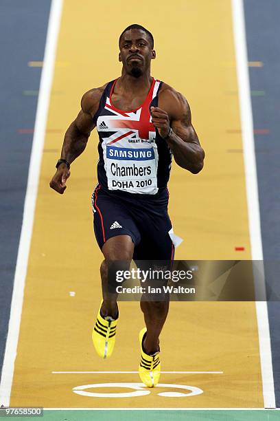 Dwain Chambers of Great Britain competes and wins his Mens 60m Heat during Day 1 of the IAAF World Indoor Championships at the Aspire Dome on March...