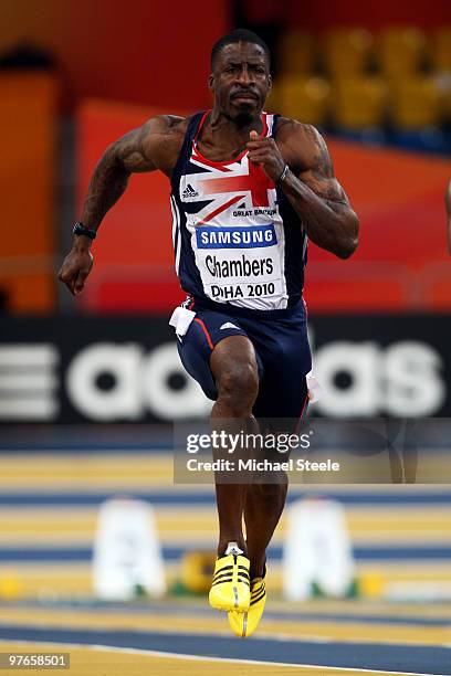 Dwain Chambers of Great Britain competes and wins his Mens 60m Heat during Day 1 of the IAAF World Indoor Championships at the Aspire Dome on March...