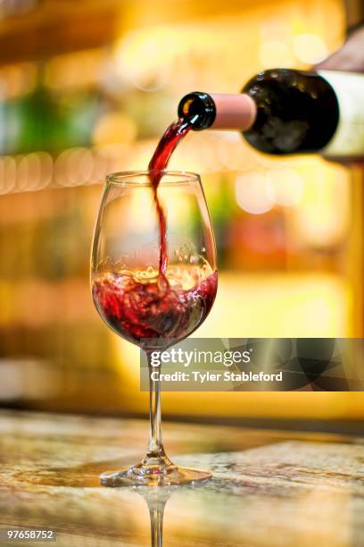 red wine is poured into wine glass in restaurant. - carbondale colorado bildbanksfoton och bilder