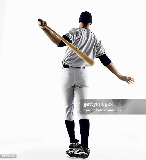 baseball player hitting home run from behind - home run stock pictures, royalty-free photos & images