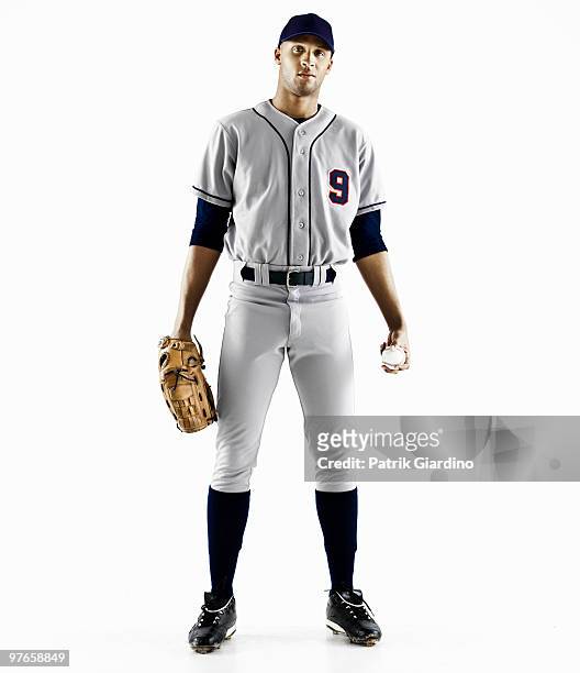 baseball player with glove and baseball - divisa sportiva foto e immagini stock