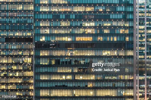 crowded office buildings at night - building front view stock pictures, royalty-free photos & images
