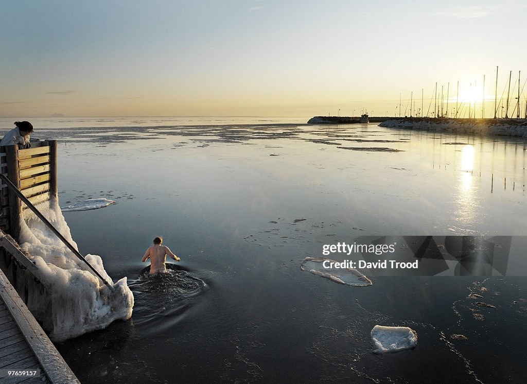 Man in icy sea.