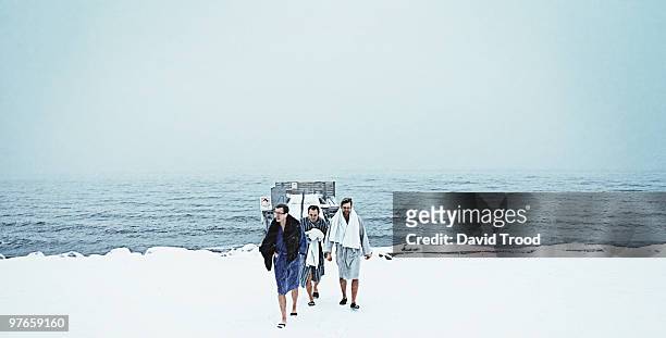 three male winter bathers - david trood stock pictures, royalty-free photos & images