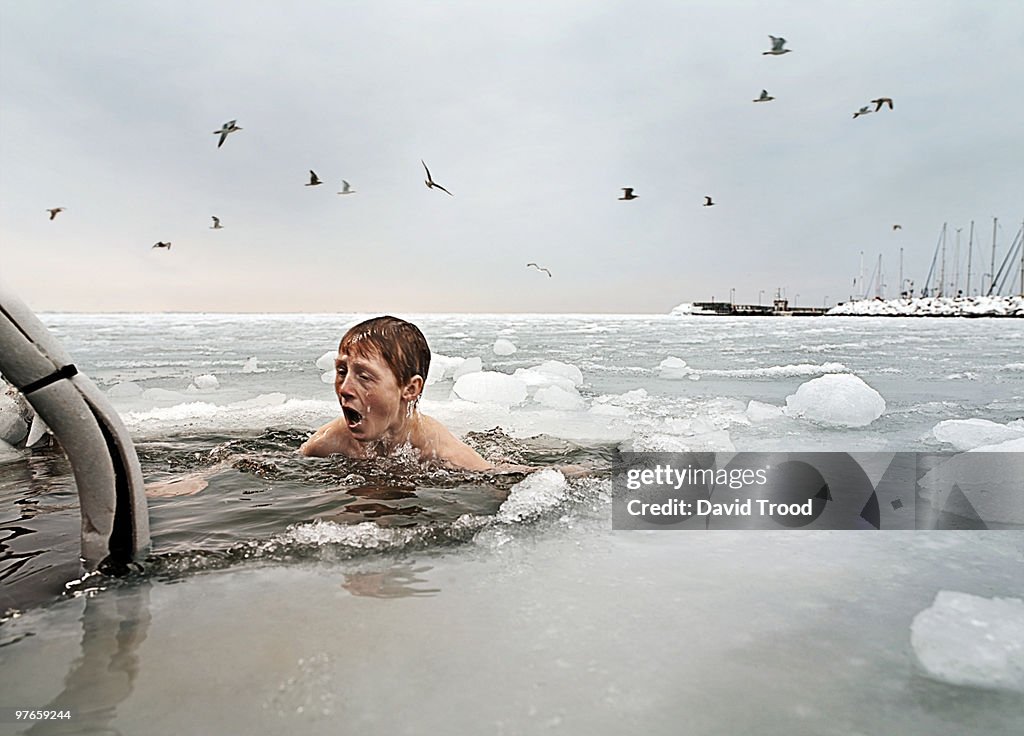 Boy in frozen sea.