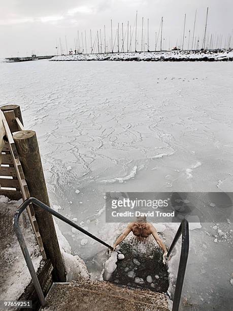 elderly man winter bathing - david trood stock pictures, royalty-free photos & images