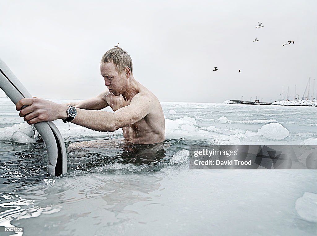 Viking man bathing in a hole in the icy sea.