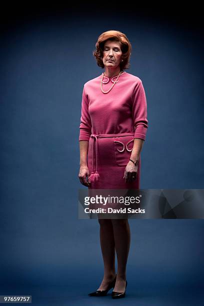 woman in vintage pink dress with eyes closed  - fatigue full body stock-fotos und bilder