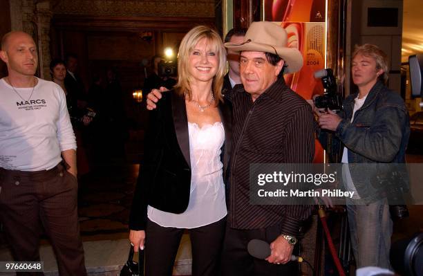 Olivia Newton-John and Molly Meldrum pose at the APRA Awards at the Regent Theatre on 24th May 2004 in Melbourne, Australia.