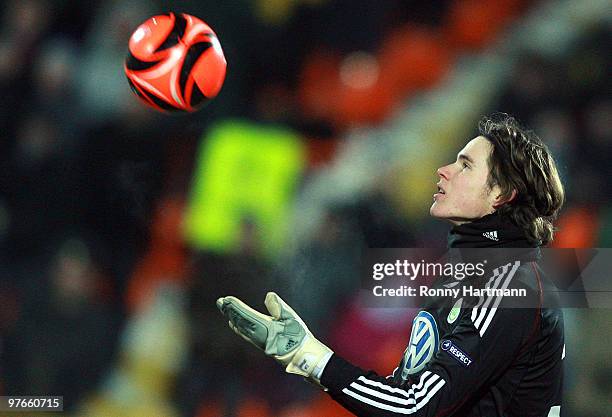 Goalkeeper Marwin Hitz of Wolfsburg intercepts the ball during the UEFA Europa League round of 16 first leg match between Rubin Kazan and VfL...