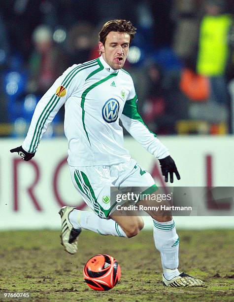 Christian Gentner of Wolfsburg runs with the ball during the UEFA Europa League round of 16 first leg match between Rubin Kazan and VfL Wolfsburg at...