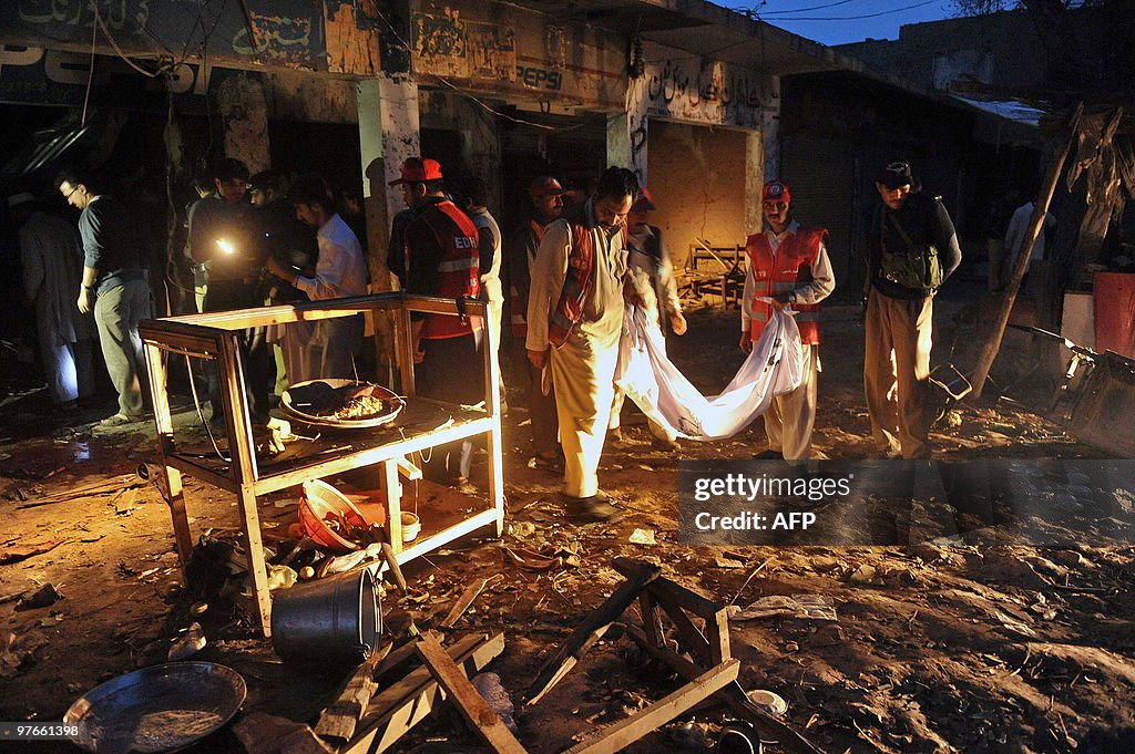 Pakistani police officials inspect the s