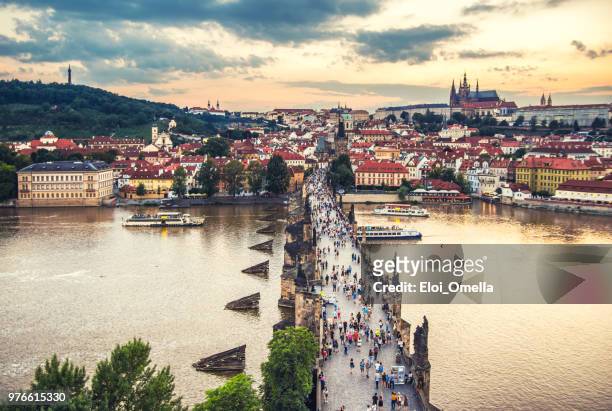 charles bridge in prague at sunset. czech republic - st vitus cathedral prague stock pictures, royalty-free photos & images