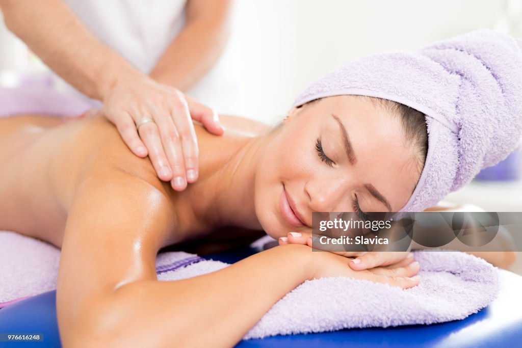 Beautiful woman getting back massage