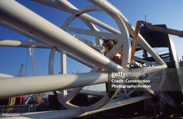 Wembley stadium-London: Inspecting welds on the interlacing steel tubes of the signature arch, constructed on the ground by Cleveland Bridge After...